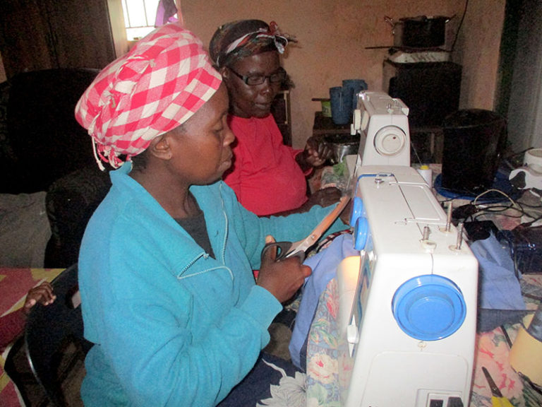 Thandeka Mkhize has a sewing business, and she trains new group members how to sew.