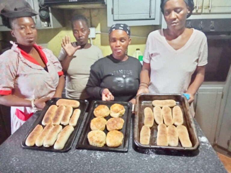 These young women from are sharpening their skills through practical training in baking techniques.