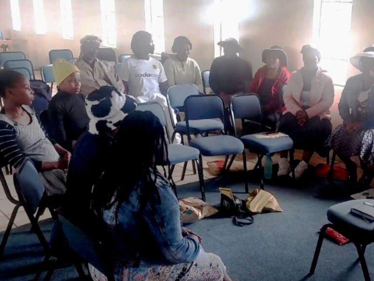 Impendle Area Implementing Committee members gather for their monthly meeting.