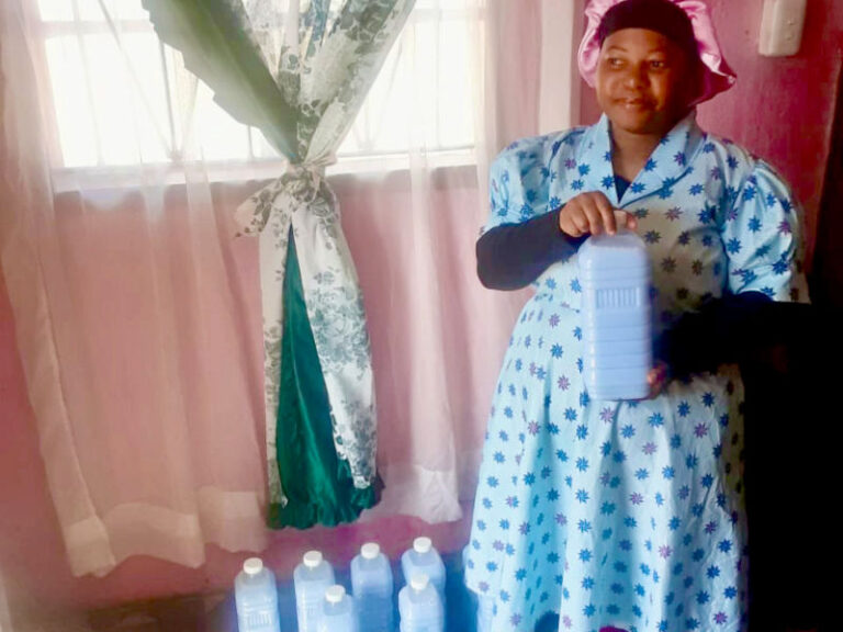 Zama Miya proudly showcases her produce.